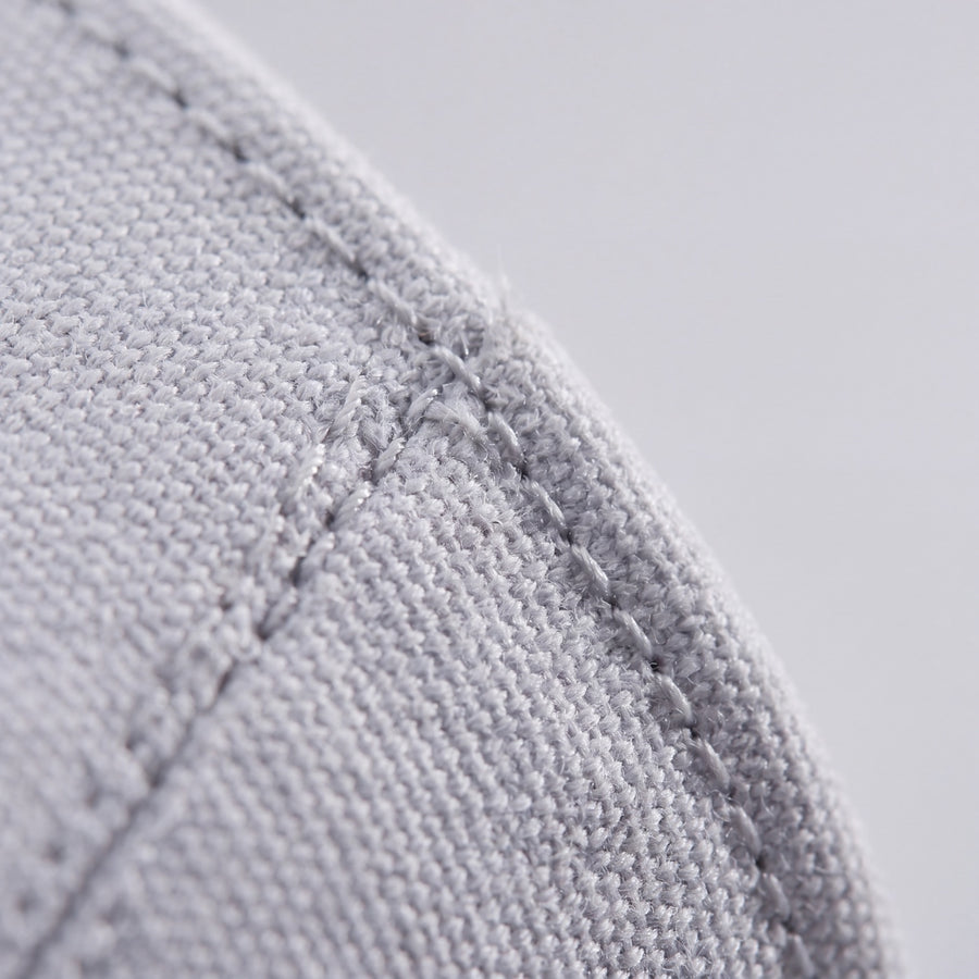 A stitched panel edge on the premium cotton canvas used on Volt.