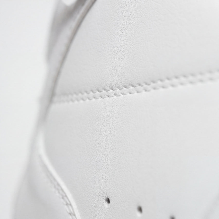 The surface grain of the premium microfiber upper, in close-up.