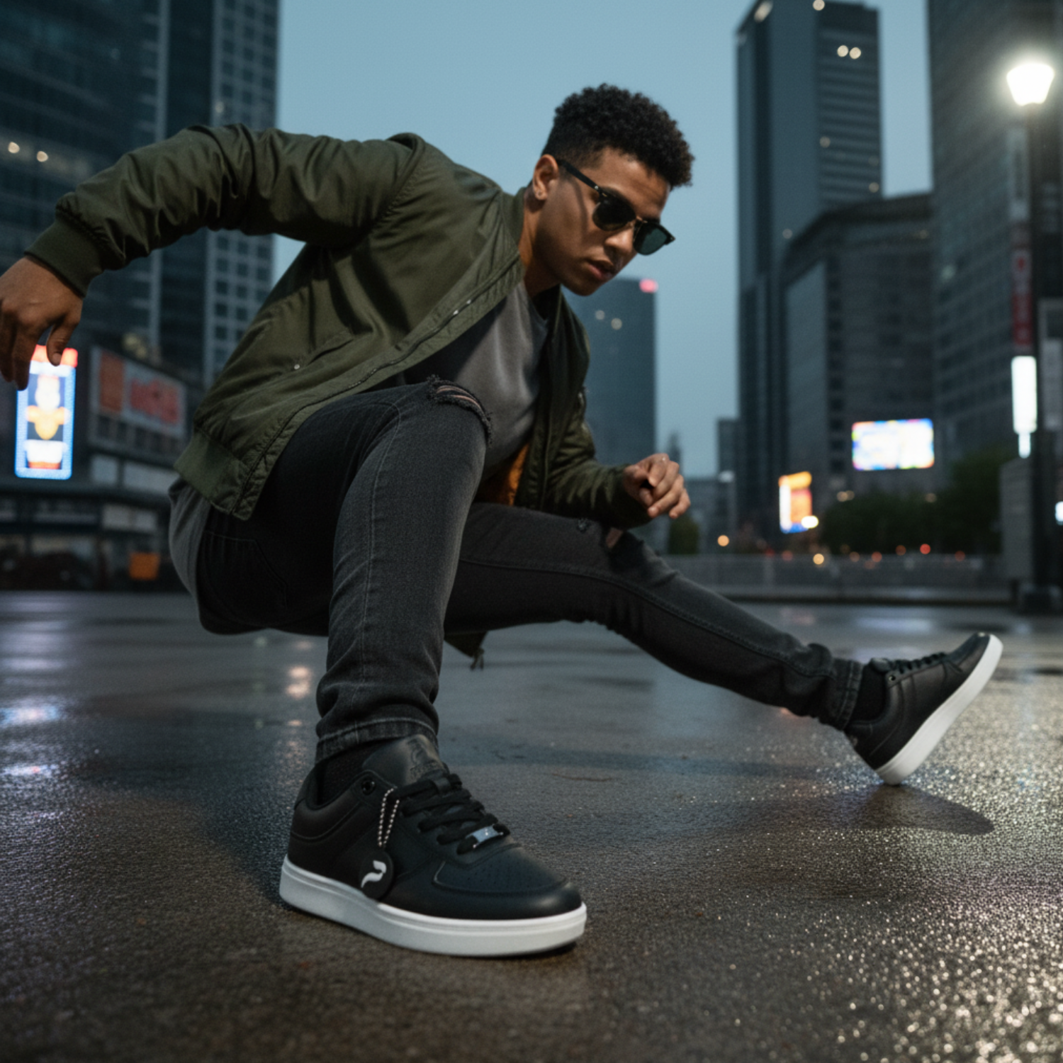 Person in urban setting wearing black sneakers and dark clothing
