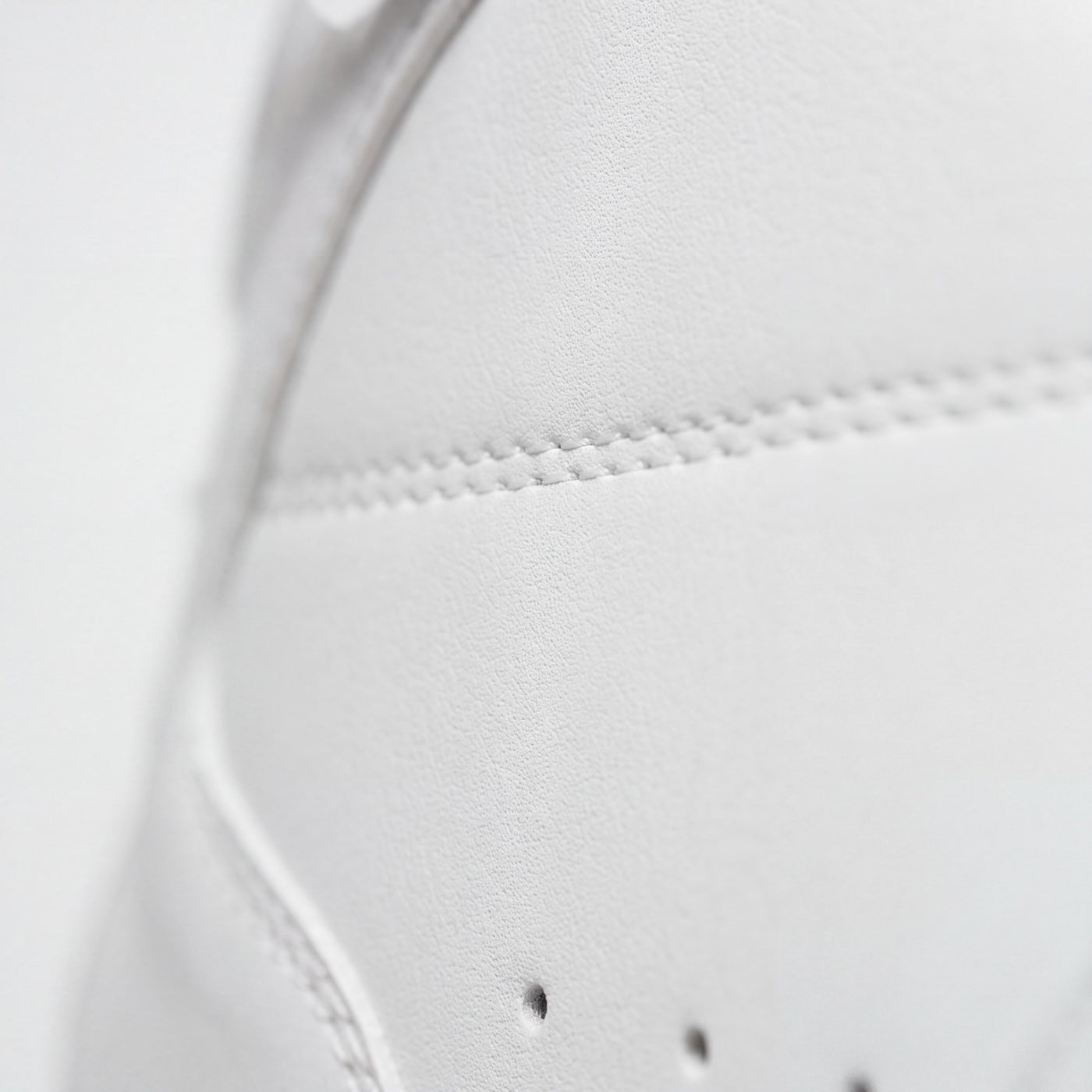 The surface grain of the premium microfiber upper, in close-up.