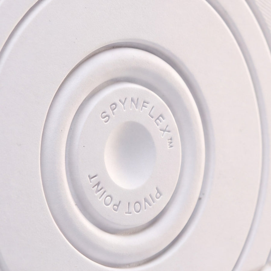 The SPYNFLEX® pivot point in close-up, showing the molded mark and the rings around it.